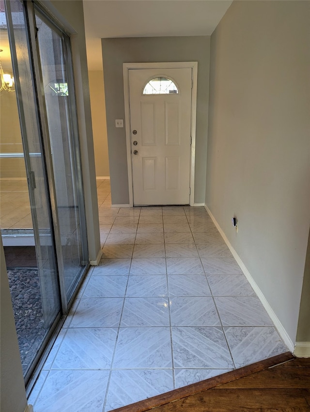 entryway with light tile patterned flooring