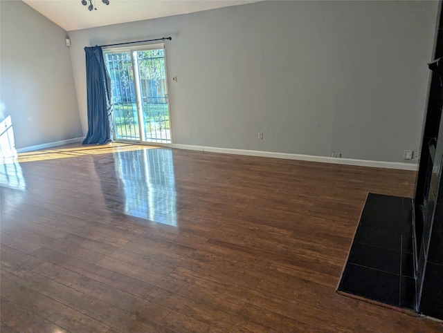 unfurnished living room featuring dark hardwood / wood-style flooring