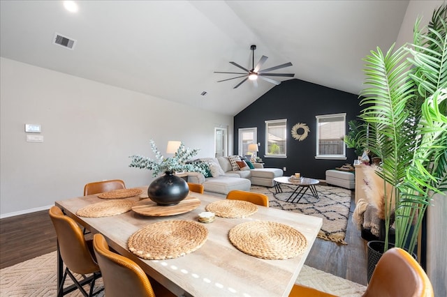 dining room featuring wood-type flooring, ceiling fan, and vaulted ceiling