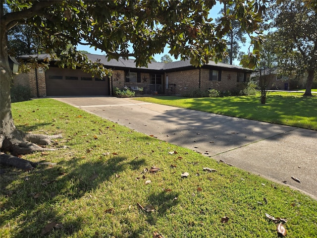 single story home featuring a front yard and a garage