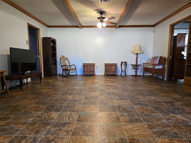 sitting room featuring crown molding, wood walls, and ceiling fan