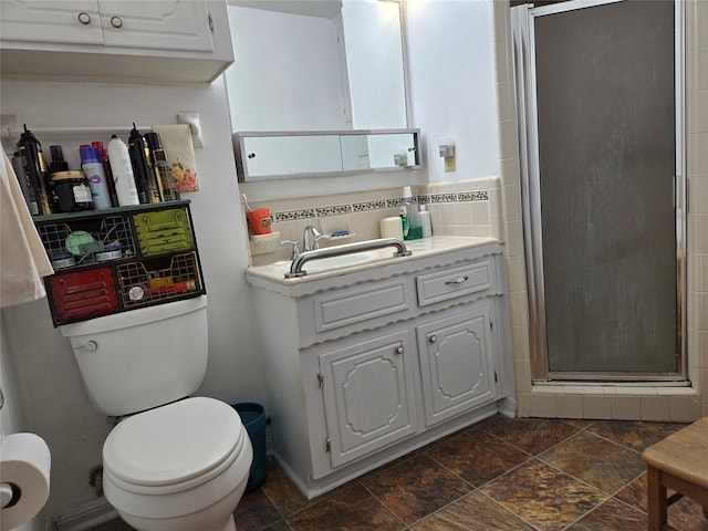 bathroom with a shower with door, toilet, backsplash, and vanity