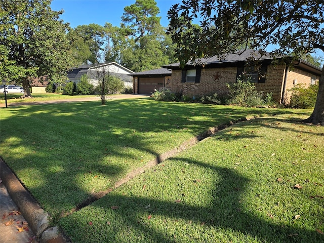 view of yard featuring a garage