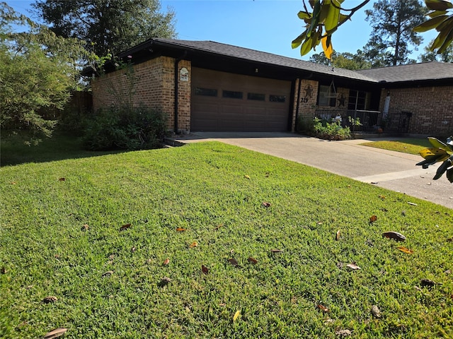 ranch-style home with a front yard and a garage