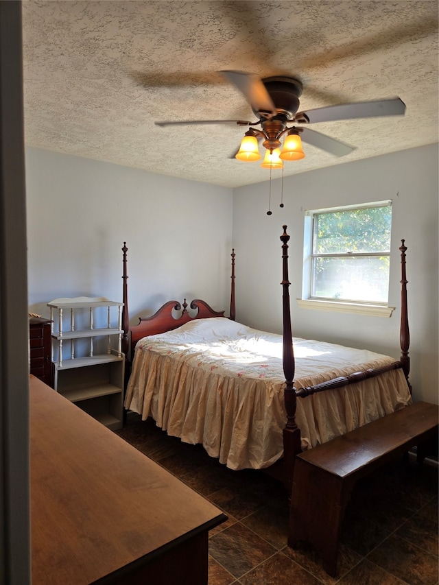 bedroom with a textured ceiling and ceiling fan