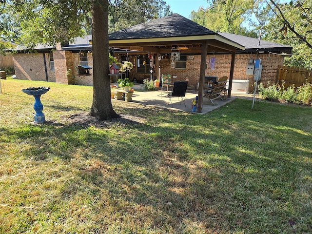 view of yard featuring a patio area and ceiling fan