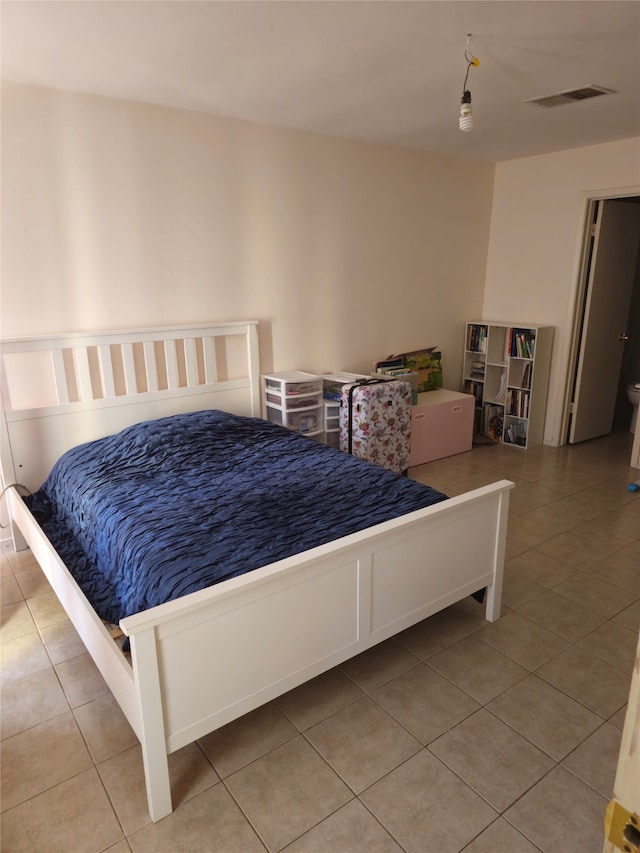 bedroom featuring light tile patterned floors