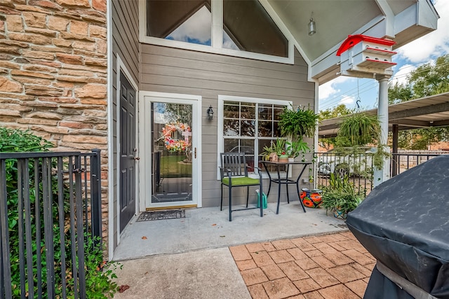 entrance to property with a patio