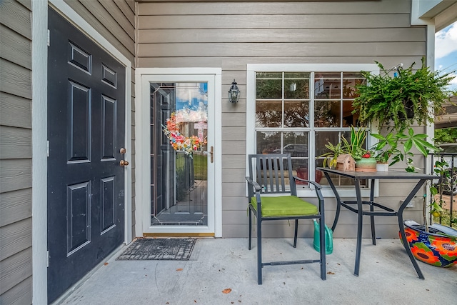 entrance to property with a patio