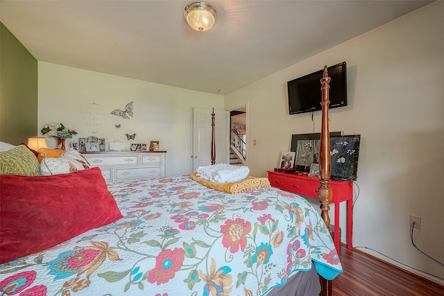 bedroom with hardwood / wood-style floors