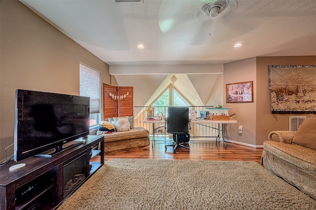 living room with ceiling fan and hardwood / wood-style floors