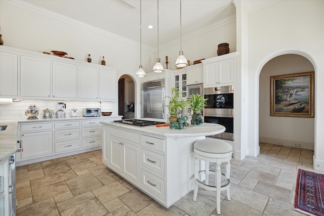 kitchen featuring a center island, white cabinetry, and appliances with stainless steel finishes