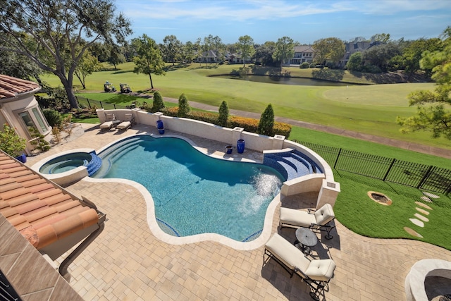 view of swimming pool featuring a lawn, an in ground hot tub, a water view, and a patio