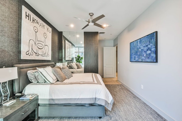 bedroom featuring light hardwood / wood-style floors and ceiling fan