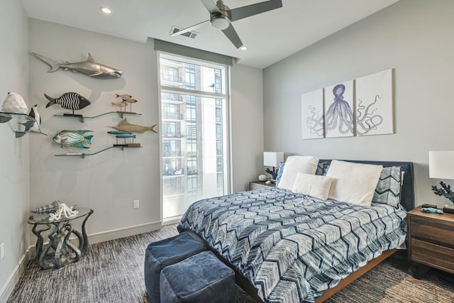 bedroom with ceiling fan and dark carpet