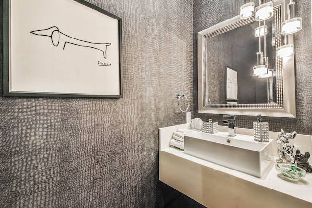 bathroom with vanity and tasteful backsplash