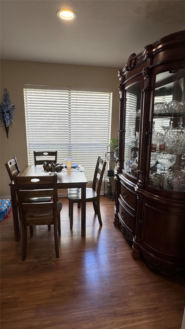 dining room with dark hardwood / wood-style floors