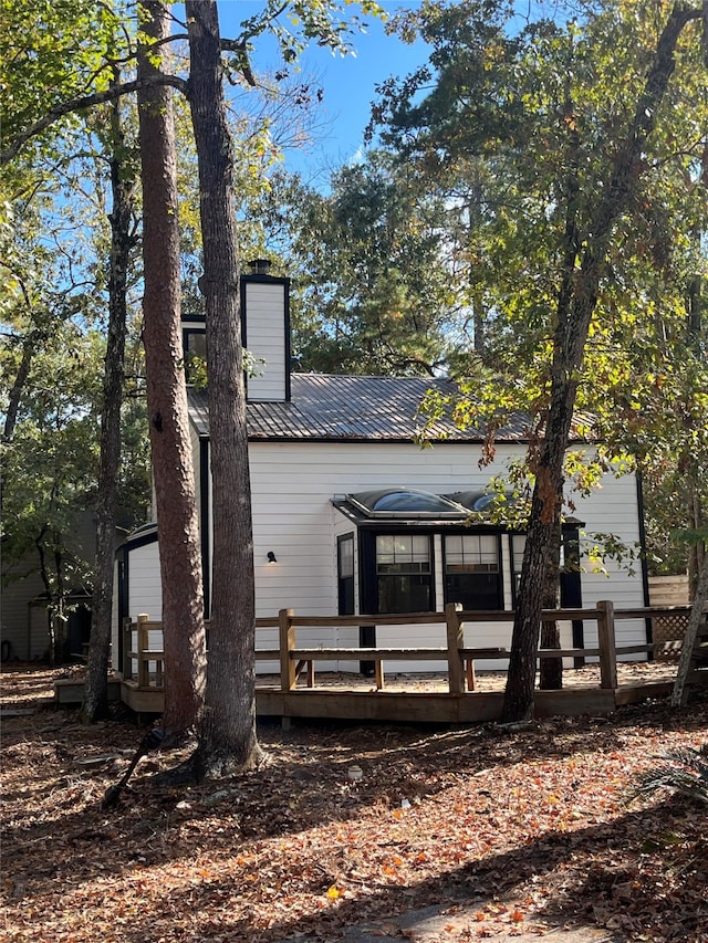 view of front of property featuring a wooden deck