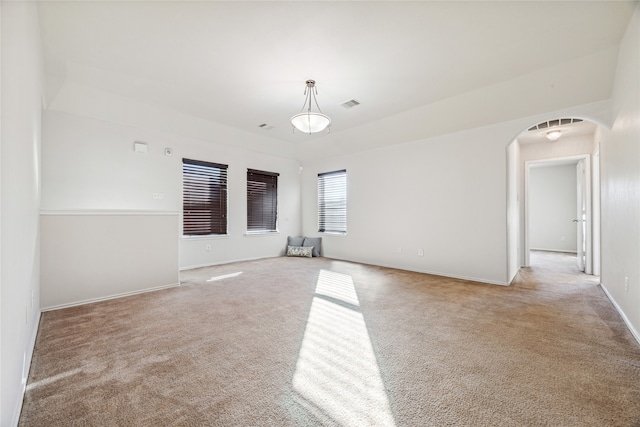 unfurnished room with light colored carpet