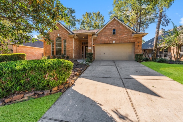 front of property featuring a front lawn and a garage