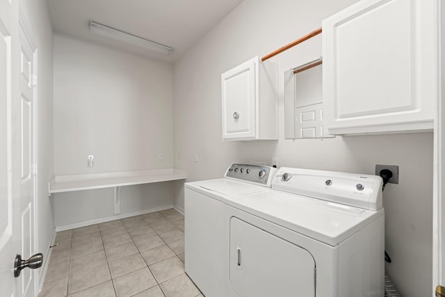 23 Wilmington Way, Conroe, TX 77384 - washroom with cabinet space, washer and dryer, and light tile patterned floors