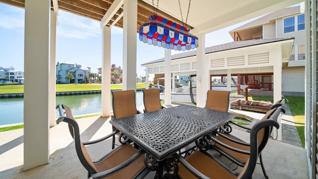 view of patio with a water view