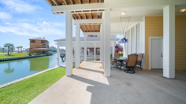 view of patio with a water view