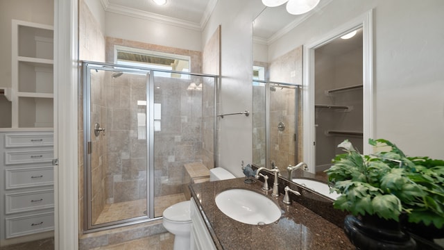 bathroom featuring vanity, an enclosed shower, ornamental molding, and toilet