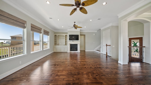 unfurnished living room with ornamental molding, dark hardwood / wood-style floors, and ceiling fan