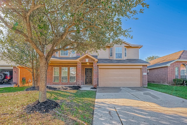 view of front of property with a garage and a front yard