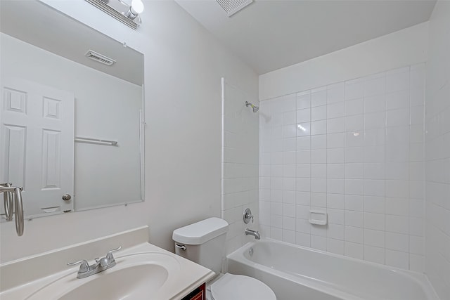 full bathroom featuring vanity, toilet, and tiled shower / bath