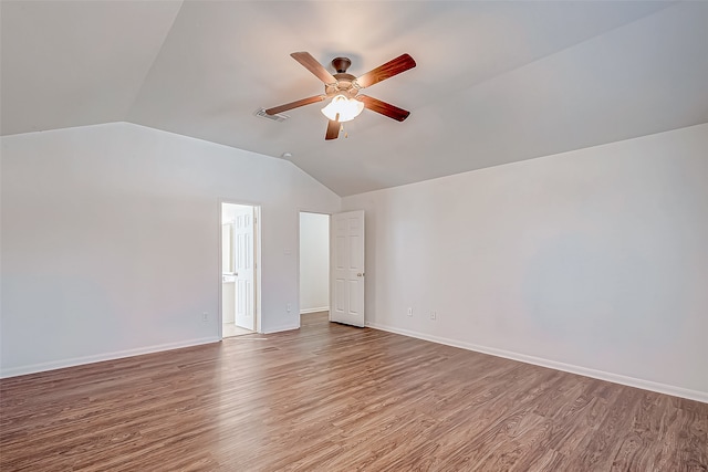 interior space with hardwood / wood-style floors, vaulted ceiling, and ceiling fan