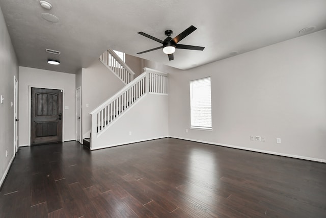 unfurnished living room with ceiling fan and dark hardwood / wood-style floors