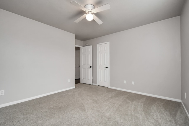 unfurnished room with carpet floors and ceiling fan