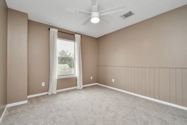 carpeted empty room with ceiling fan