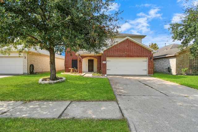 view of front of house with a front yard and a garage