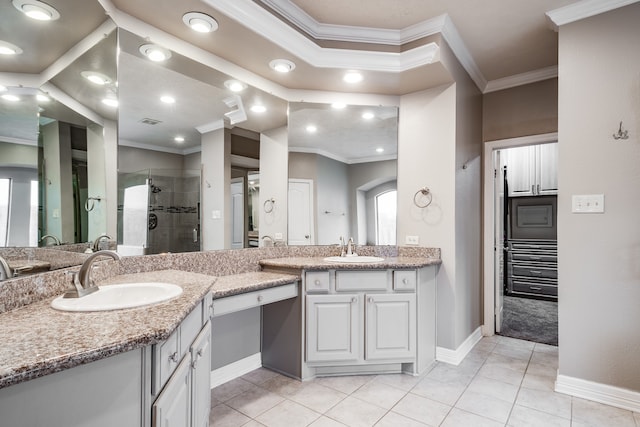 bathroom featuring tile patterned flooring, vanity, an enclosed shower, and ornamental molding