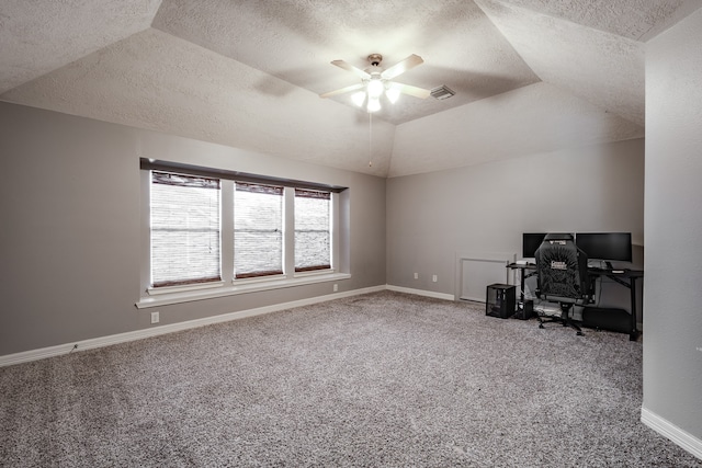 office with carpet flooring, a textured ceiling, vaulted ceiling, and ceiling fan