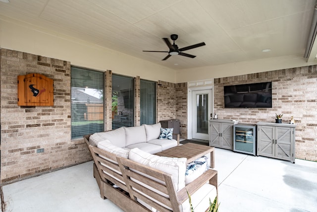 view of patio / terrace with outdoor lounge area, wine cooler, and ceiling fan