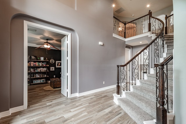 interior space with ceiling fan and wood-type flooring