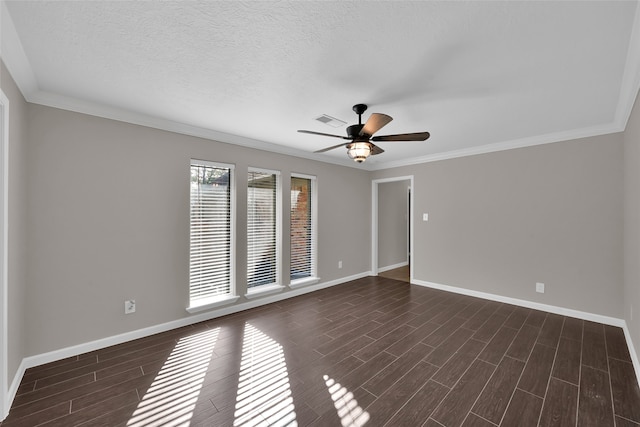 empty room with crown molding, dark hardwood / wood-style floors, a textured ceiling, and ceiling fan