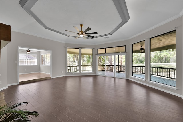 spare room with ornamental molding and dark wood-type flooring