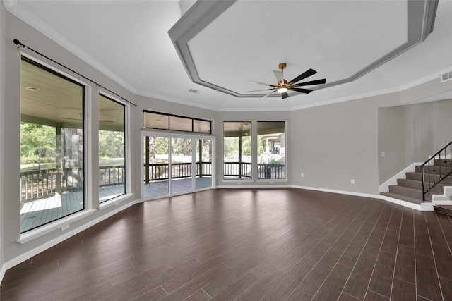 interior space with crown molding, dark wood-type flooring, plenty of natural light, and ceiling fan