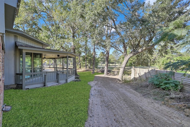 view of yard with ceiling fan