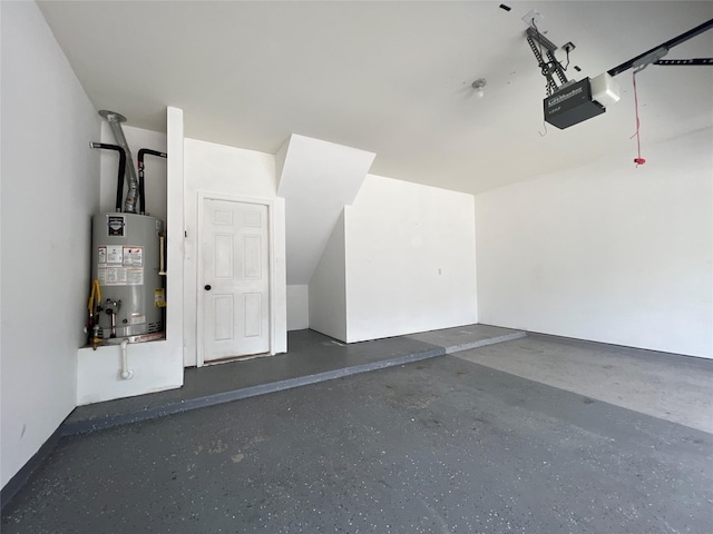 garage featuring gas water heater and a garage door opener