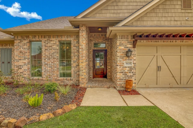 entrance to property featuring a garage