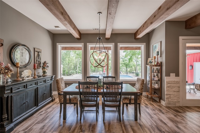 dining room featuring beamed ceiling, wood-type flooring, and an inviting chandelier