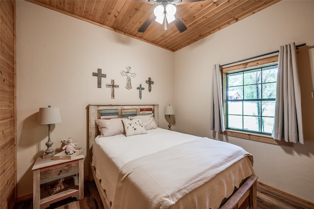 bedroom with hardwood / wood-style floors, ceiling fan, vaulted ceiling, and wood ceiling