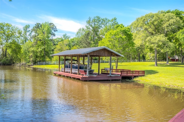 view of dock with a gazebo, a yard, and a deck with water view