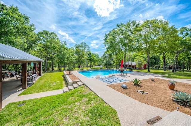 view of pool with a gazebo, a patio area, a yard, and a shed